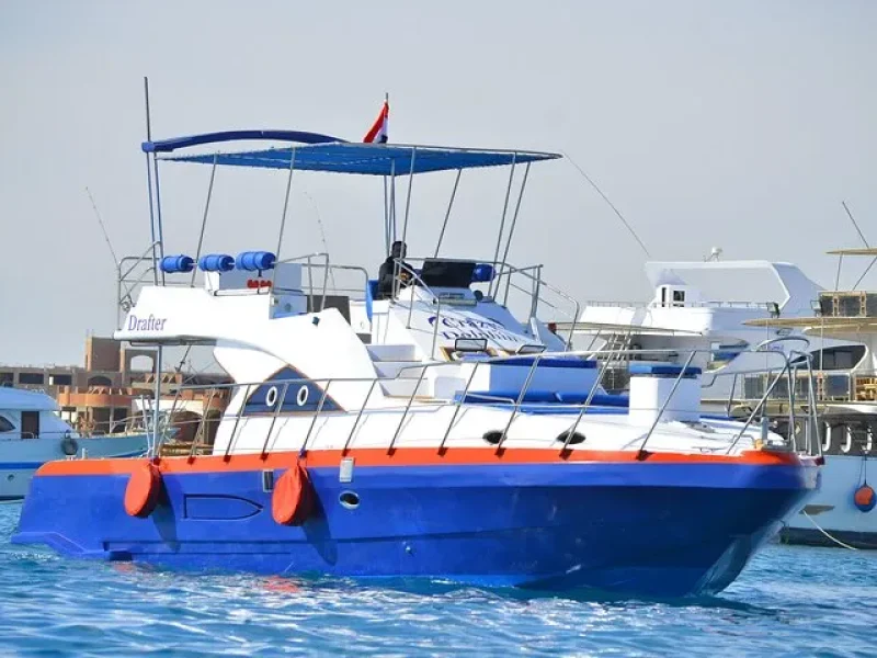 Family enjoying a private boat trip with fishing, snorkeling, island hopping, and lunch in Hurghada 